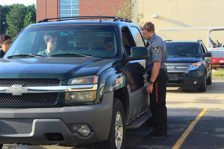 Explorer Birkett and Cervantes approach the car carefully, as Birkett checks the drivers’ license. This is an important factor in traffic stops. “Its fun to improvise and mess with the acting officers.”