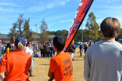 From the far sides of the course, the North Cobb flag could be seen to cheer on the boys. Freshman Ginji Ozawa, whose brother Ricky ran in the State race, took on the task of flagbearer. 