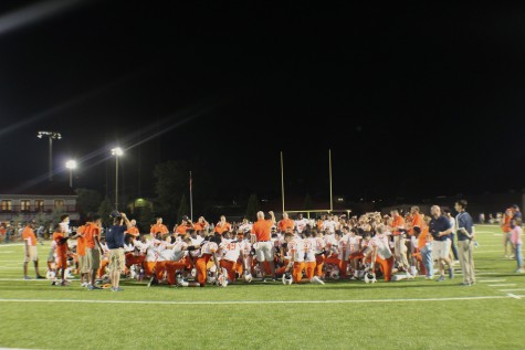 North Cobb’s varsity and JV team in a prayer circle after winning against Lassiter 34-21.