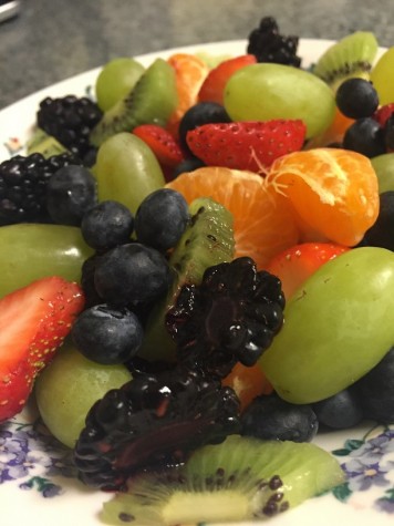 Fresh fruit salad with oranges, grapes, kiwi, and berries.