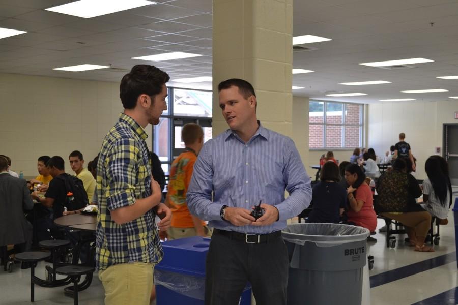 Mr. Revard discusses vision for The Tribe app with junior Alex Flack.