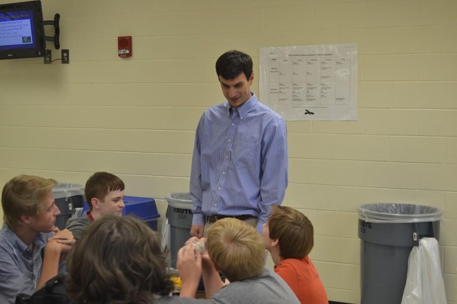 Mr. Noblet checks in with students in the freshman academy cafeteria.