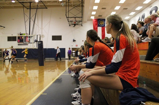 Lizzy Daniel and team watch the action during a game her junior year.