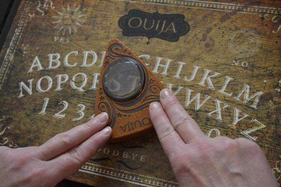 Ouija, released October 24, tries to terrify audiences by perpetuating the myths and superstitions associated with a board able to contact the dead.

