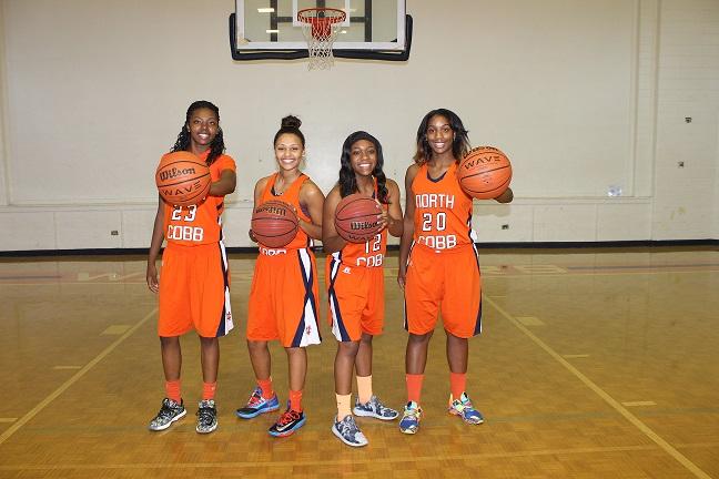 Seniors Ty Broadwater, Chantel Strahon, Kyrie Chandler, and Kristian Carter exude nothing but grins in their orange uniforms, eager for signing day.