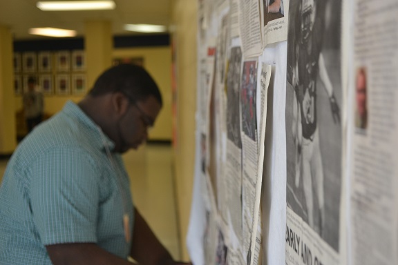 This semester, North Cobb athletics has made many achievements, each one topping the last. Making more room for the future recognition, senior Thomas Smith takes down old articles outside the cafeteria.
