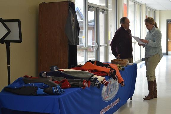 Neff Co. set up its tables in the cafeteria today during lunch to sell official North Cobb letter jackets to students. “I’m excited that they are here! My daughter really wanted a letter jacket!” said Ms. Ezzell. 