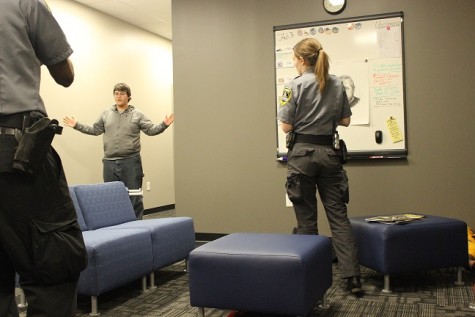 Junior Austin Ingraham is being arrested in an officer down scenario. Kennesaw State student Allison Owens holds her weapon at the perpetrator, Ingraham, who was previously holding a bloody shovel.