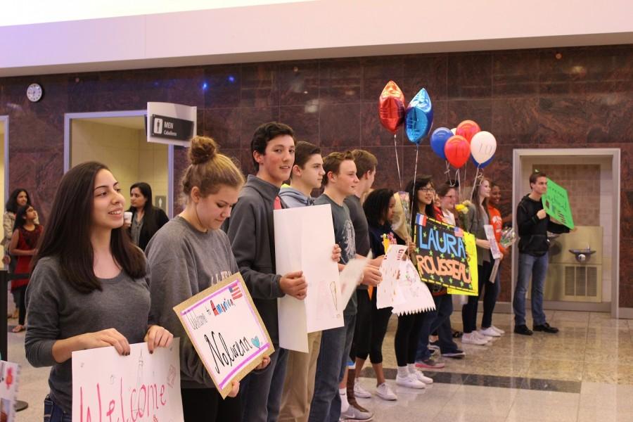 Host students line up in the International Terminal at Hartsfield-Jackson Airport with handmade signs to welcome the French Exchange students to the United States.