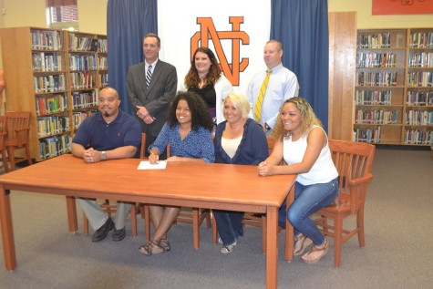 Attending the University of Illinois at Springfield, Morgan completes the anticipating contract signing.