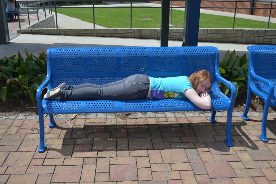 Many students gather outside to enjoy the sunny weather after a long rainy week. “It was a long weekend because I had to work, so I am very tired” said Lora LaFore, a student who decided to nap on the bench during lunch.
