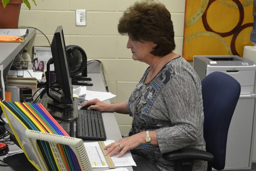 Mrs.Stoll, working in the Freshman Academy attendance office,  cross references student information with the ones on the computer. When asked how she would describe herself, she answered “organized and dedicated.”
