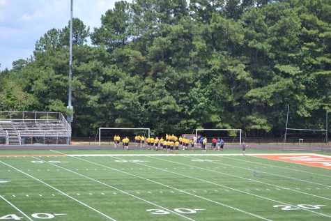 North Cobb NJROTC continues their warm up routine on the football field, while braving the summer heat. 
