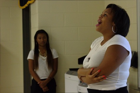 Newly elected Club Vice President, Tierra Addison, gives speech, while Club President Danielle Kelly watches on. 
