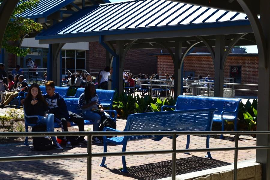 10th, 11th and 12th grade students fill the outdoor seating during A lunch today. At a chilly 69 degrees, NC students begin to anticipate early fall weather.
