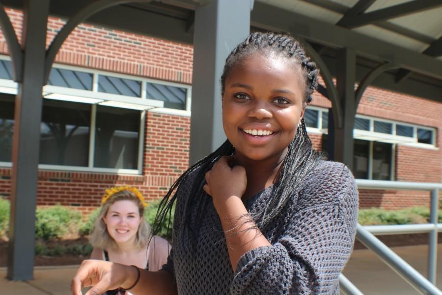 Titi, a South African exchange student, enjoying her first lunch at North Cobb with friend Kimberly Hoffman.