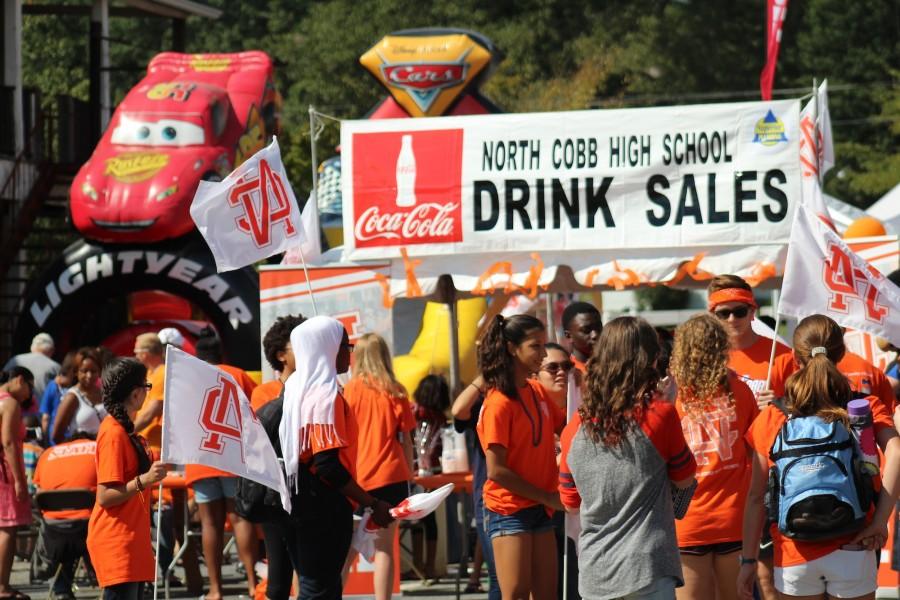 North Cobb students volunteered on Saturday to help out with the school’s booth and promote school spirit. 