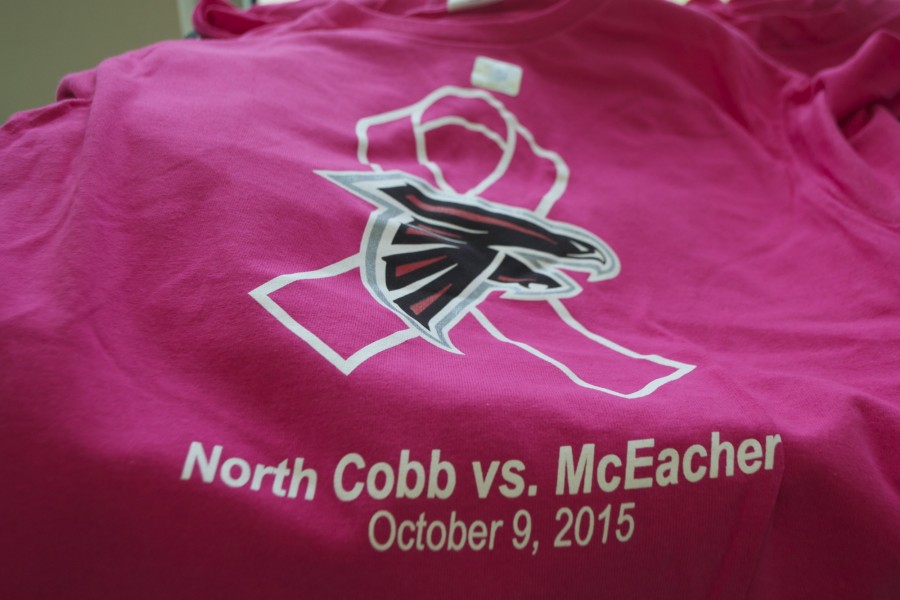 Local+representatives+from+the+Atlanta+Falcons+sell+special+edition+pink+out+t-shirts+sponsored+by+the+team+for+tonights+football+game+against+McEachern.+The+profits+from+the+shirts+go+to+Northside+Hospital+Cancer+Institute.+The+game+will+include+special+events+like+appearances+by+Falcons+cheerleaders+and+the+mascot%2C+and+a+fireworks+show.