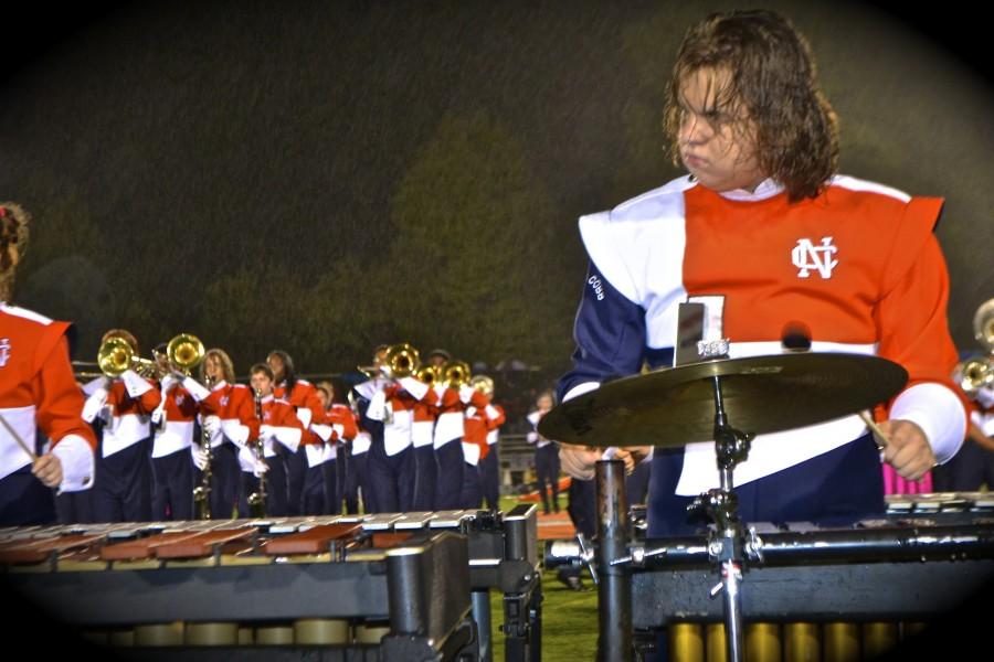 Dakota Griggs spent his Alumni Night with the Percussion section and helping Alumni members with questions. The rain during his performance did not disappoint him as he enjoyed playing with others.