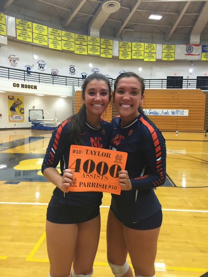 Parrish (right) smiles with teammate Shannon Callan after becoming one of three girls in state history to tally 4000 assists.