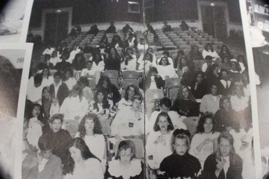 In 1991, students assemble in the NC theatre to listen to important news from the administration and staff.

