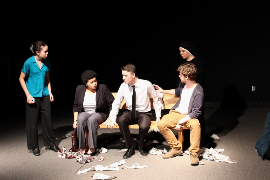 From left to right, a businesswoman (Hope Kutsche, freshman), a lawyer (Alexia Howell, senior), a businessman (Jordan Hicks, sophomore), a professor (Connor Crafton, junior), and a nun (Kelly Vislocky, senior) meet a subway station. Rather than sounding like a mildly offensive joke, Tracks by Peter Tarsi turns out to be a thought-provoking piece of art. 