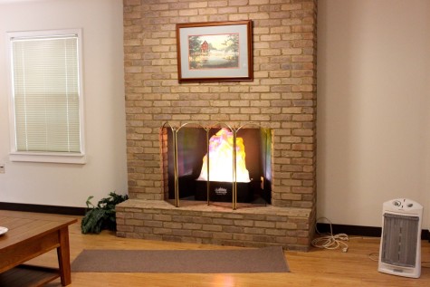 Inside Sparky’s house, a fake fire blazes in the fireplace. The house aids in the education of fire safety by exemplifying specific fire hazards children may run into.