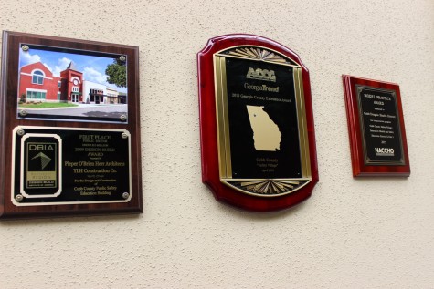 The Cobb County Safety Village displays its awards, including the 2009 Design Build Award, the 2010 Georgia County Excellence Award, and the Model Practice Award from the National Association of Counties.