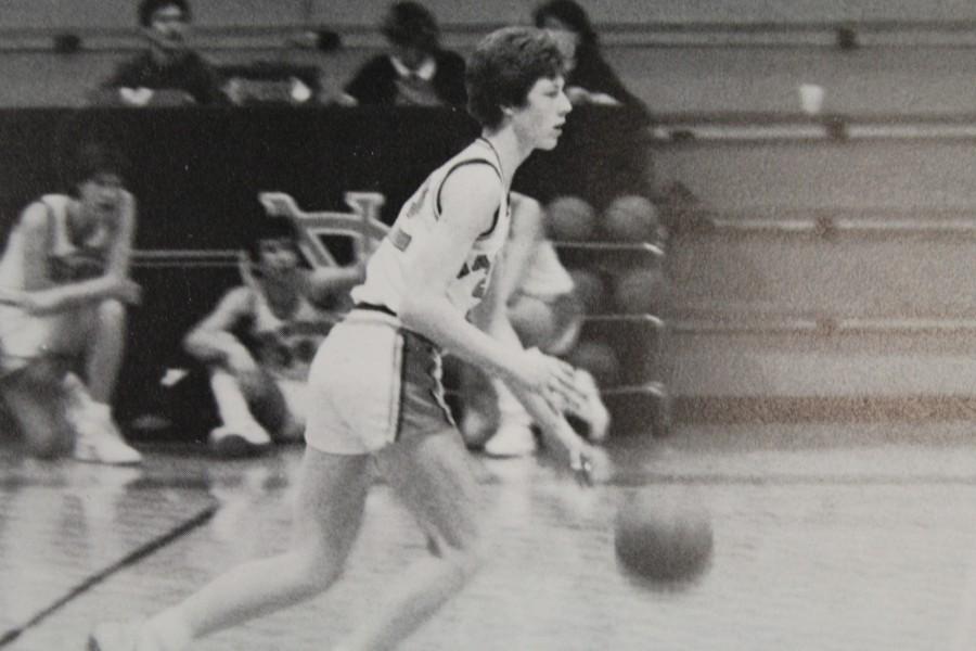 Varsity basketball player, Mark Rogers, brings an end to the Warrior and Raider face off in 1987.