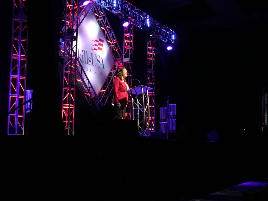 Georgia State President for SkillsUSA, Lexi Medina, gives a speech for the closing ceremony for the last time. 