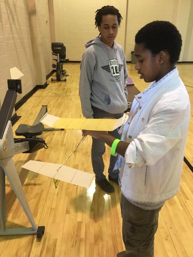  Senior David Kem and freshman Nathaniel Kem construct a glider made out of light material including wires and rubber bands. Their objective was to create a glider and see how long it could stay in the air. 