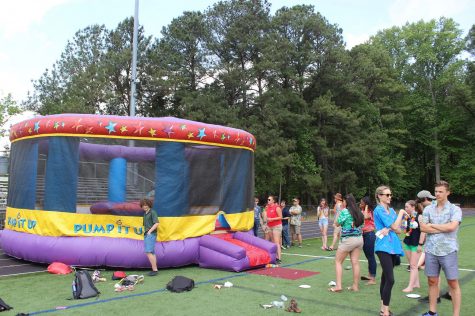 Inflatable bounce houses made for nostalgic fun for the graduating class. 