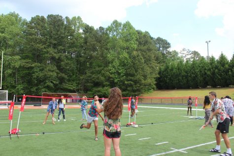 “I really like that we were out of class so we could actually sit down and enjoy all of our friends before we graduate,” senior Mack Brown said, pictured here at the tennis courts. 