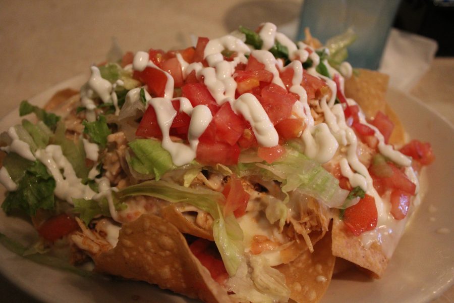 Prince and O’Brien ordered chicken nachos stacked with tomatoes, lettuce, sour cream, refried beans, and cheese dip. 