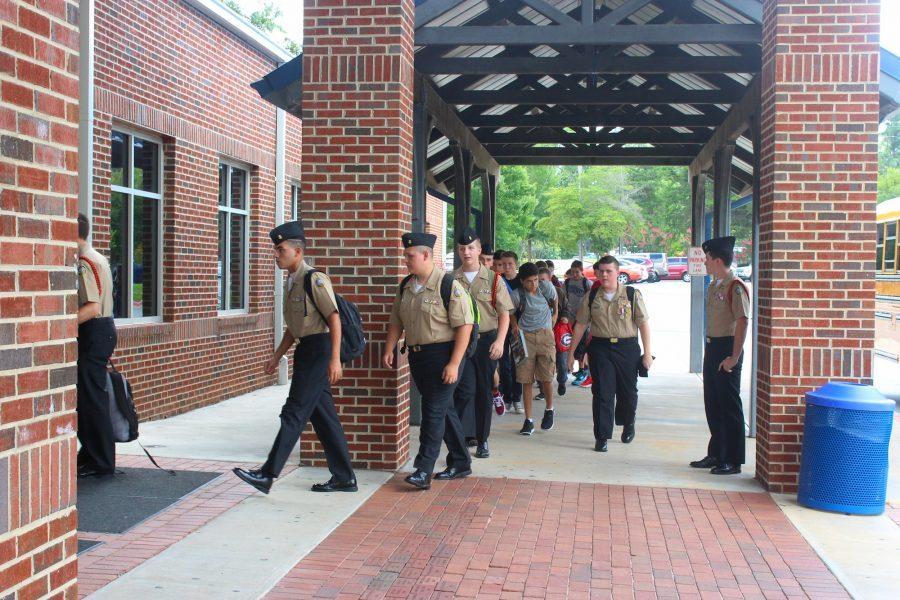 Harrison JROTC students arrive for their daily class with NC’s Commander Reeves. Friday means weekly uniform inspection, which indicates whether or not the students take care of their uniforms. The students stroll in with confidence in their appearance, and hope to do well on their inspection. 