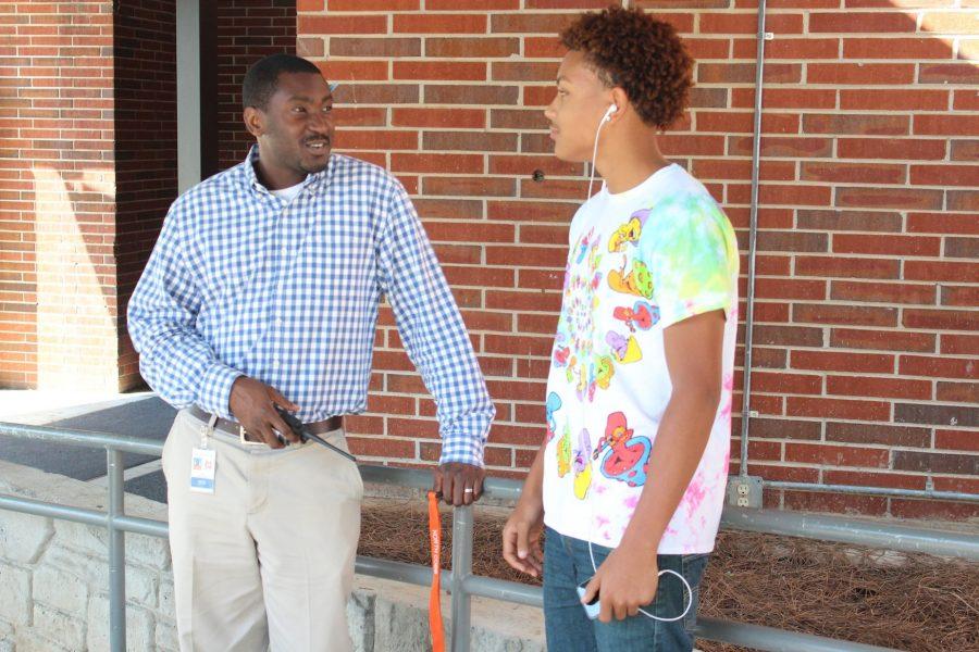Southwell only transferred to NC from Russell Elementary this year, and he has already developed a relationship with the students. Senior Josiah Roebuck, pictured talking to Southwell, considers him a helpful addition to administration. “There used to be a lot of kids just roaming the halls during class, and no one would do anything about it. Now, you rarely see anyone even trying to skip,” Roebuck said. 
