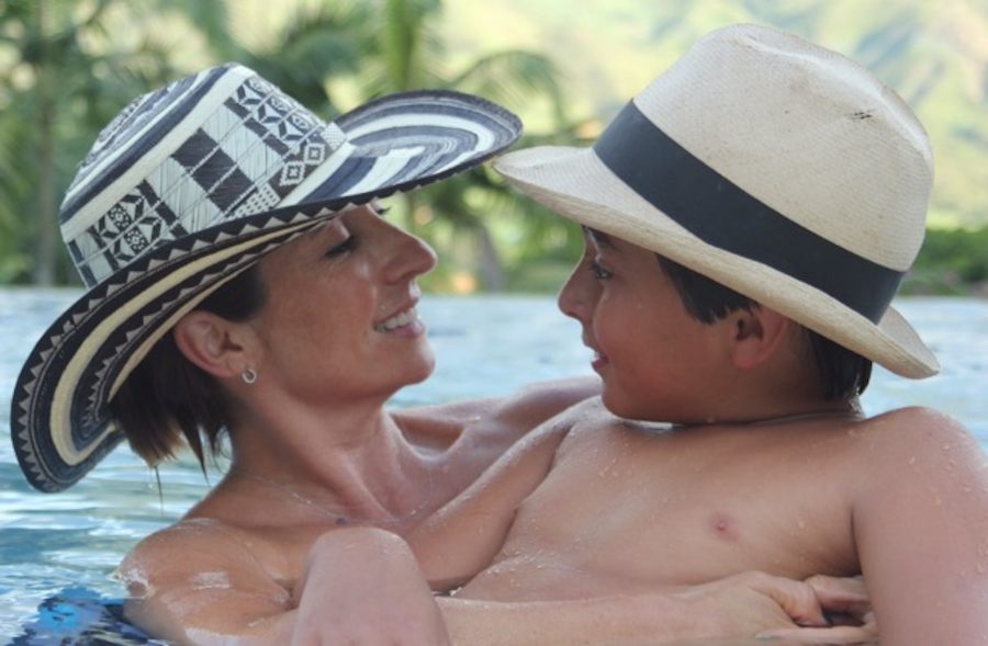 Colombian mother, Natalia Alarcon, embraces her son in front of the mountains of Medellin, speaking to him about the beauty and importance of Colombian heritage. Those enveloped and in love with their culture feel that their roles consist of passing forth the customs to their children, allowing for the culture to live on through generations. 