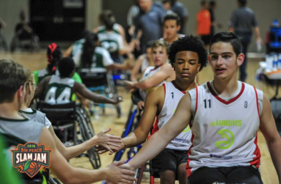Joines and teammates shake hands with Music City Thunder, Nashville’s wheelchair basketball team. Atlanta Junior Wheelchair Hawks won 5 to 1.