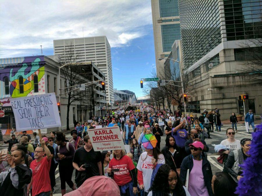 Protestors gather in downtown Atlanta to participate in the Atlanta March for Civil Rights and Women after yesterdays inauguration. More than 60,000 citizens gathered in the city center for the cause.