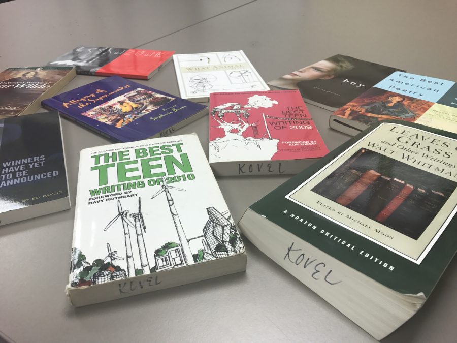 The poetry books sprawled out across the table, showing that published authors come in all ages, shapes, and sizes. 
