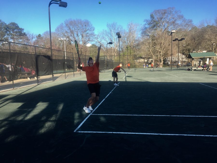 Sophomores Reed Walker and Blake Howell warm up serves prior to playing line 1 doubles against Hillgrove High School. NC varsity boys advanced to the championship after defeating Hillgrove and received 2nd place in the Granger Invitational Tennis Tournament.   
