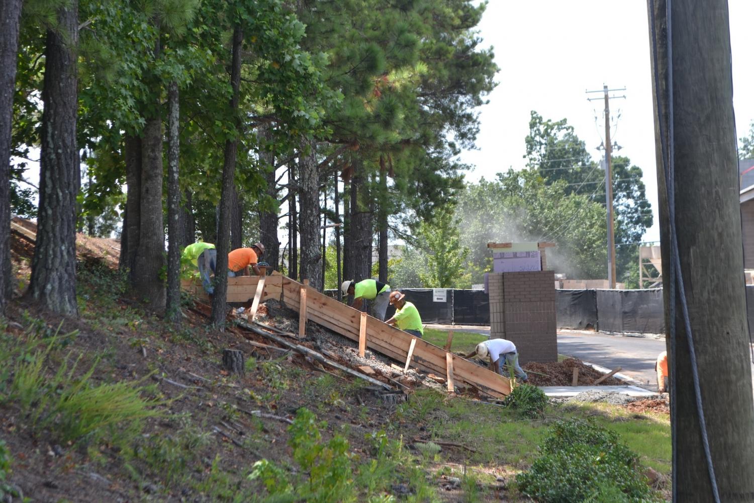 A new set of stairs at the bus ports has begun as construction of the new theater continues at North Cobb. Leza Aldrige, a counselor for 10-12 grade, estimates the end date of the construction will be April of next year. The new addition will allow more students to reach their buses faster, and will prevent overcrowding of the old staircase.