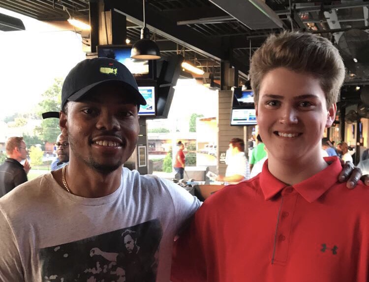 Chant reporter/photographer Sky Vinson pictured here with Atlanta Hawks guard Kent Bazemore at Bazemore’s July TopGolf Tournament, put on by the Bazemore ARMS Foundation. 