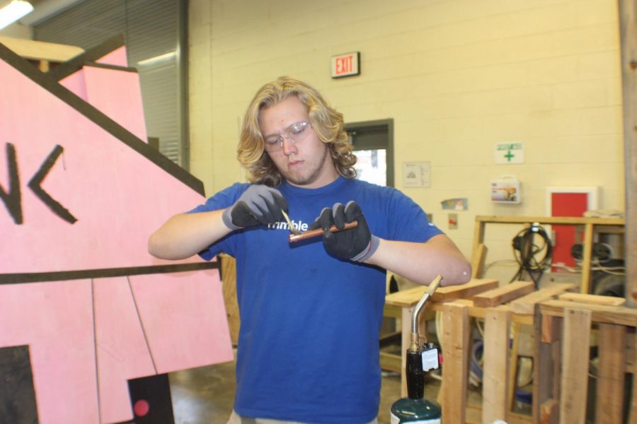NC senior Nolan Moore worked hard enough to compete in the National Skills and Leadership Conference, earning a spot in the top ten. Moore works on sweating together two copper pipes, a necessary skill for his desired occupation. Sweating involves heating a solder into the pipes to merge them. 