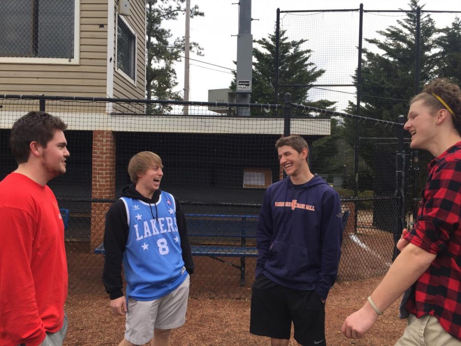 Christian Tetrault, Zack Lewis, Matthew Terrill, and Gavin Rose (pictured left to right) enjoy some laughs before suiting up for their daily practice. “Christian always makes sure everyone has a smile on their face,” Rose said. 