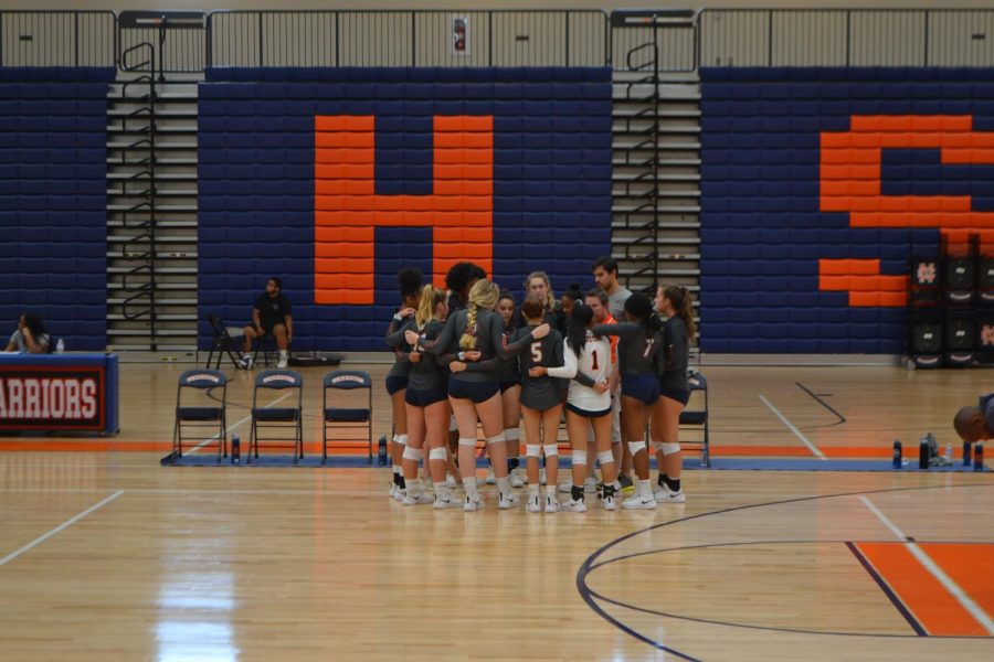 As the Lady Warriors prepare for their next set, they huddle around one last time to work out strategies. The team, desperate to pull out a win, comes to regain their composure.