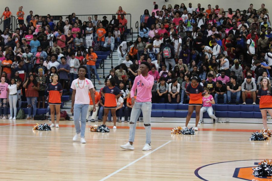 TC senior co-leaders Chike Azusu and Zion Fitch build up student excitement during a pep rally in the Arena. This ability to bring school pride out of all NC students falls high on the requirements for members.