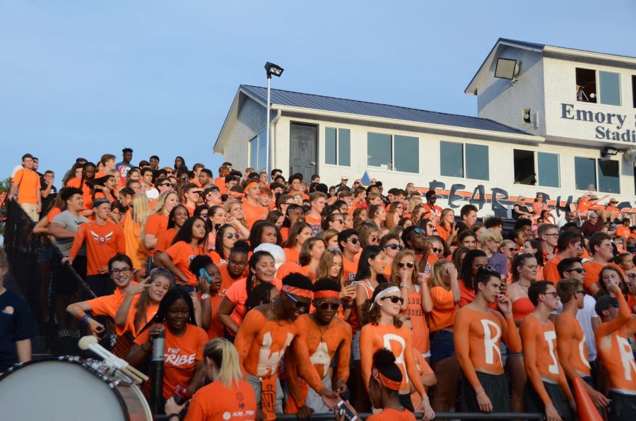 The student section exploded in a sea of orange for the first football scrimmage of the year. Students brought their school spirit and cheered on the Warriors as they played against the Harrison Hoyas. 