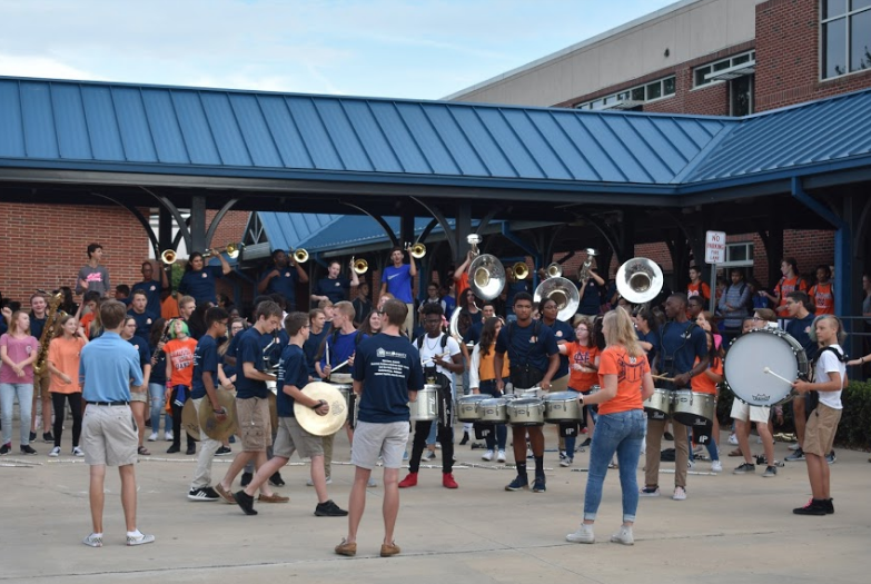 Seen here performing for onlookers on Pep Rally Day, the band shows off their hard work. In addition to displaying what the group knows thus far, this display also served to get the students excited for the football game later that night.