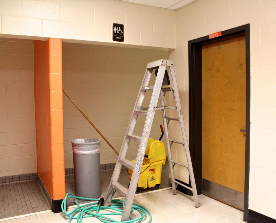 The custodians created a barricade outside of the girls bathroom in the 600 hallway using a ladder, trash can, hose, mop, and bucket to stop people from coming inside. The restroom, currently closed for maintenance, will reopen shortly. 